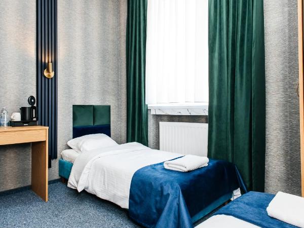 Elegant Apartments : photo 7 de la chambre chambre lits jumeaux avec salle de bains privative