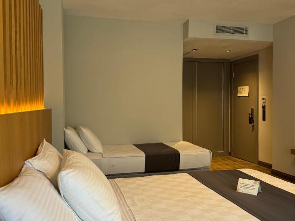 The Rest Port Argento : photo 3 de la chambre chambre triple - vue sur jardin