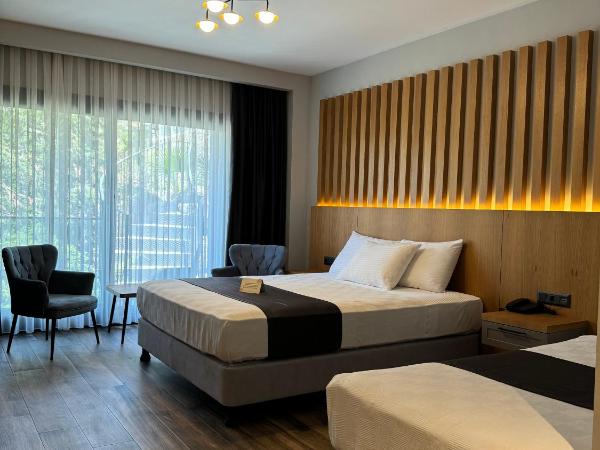 The Rest Port Argento : photo 2 de la chambre chambre triple - vue sur jardin