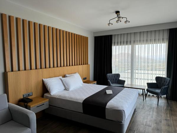 The Rest Port Argento : photo 1 de la chambre chambre double deluxe avec balcon - vue sur mer