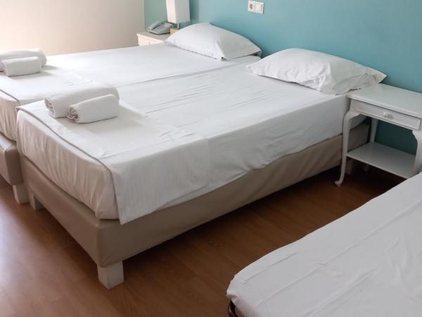 City Marina : photo 8 de la chambre chambre triple Économique avec lit d'appoint