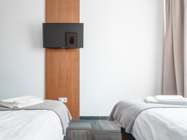 Centrum Szkoleniowo-Konferencyjne : photo 2 de la chambre chambre double ou lits jumeaux - vue sur jardin