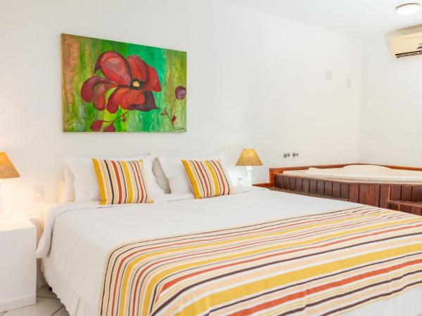 Pousada dos Reis : photo 1 de la chambre suite lit king-size avec baignoire spa