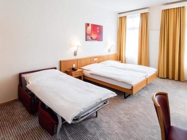 Central City Hotel Rochat : photo 10 de la chambre chambre triple