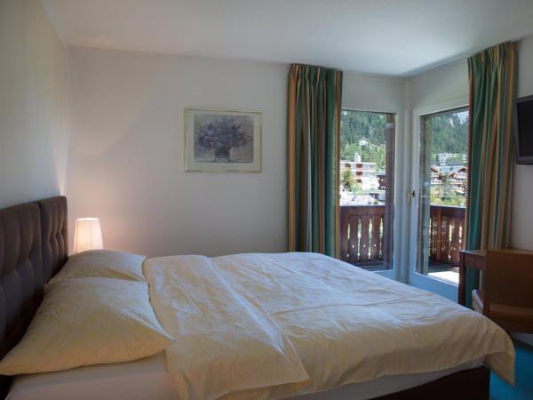 Hotel Helvetia Intergolf : photo 2 de la chambre chambre triple exécutive avec balcon - vue sur montagnes