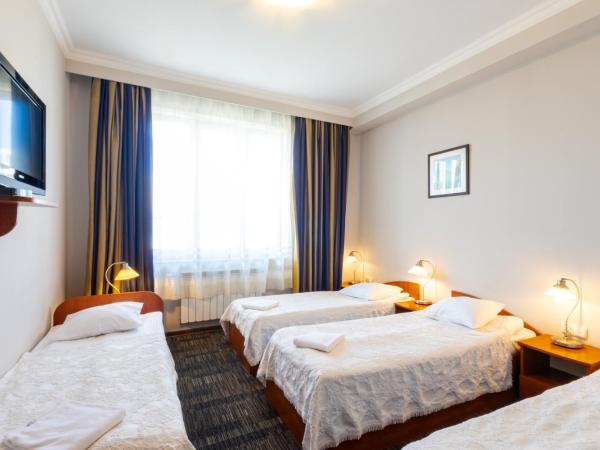Noclegi Stadion Bed & Breakfast : photo 1 de la chambre chambre quadruple