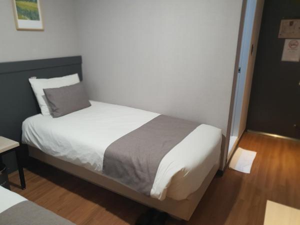 Ehwa In Myeongdong : photo 3 de la chambre chambre lits jumeaux