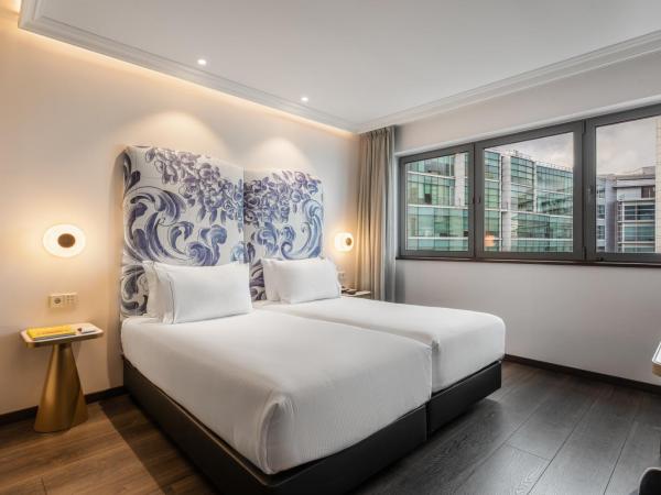 Eurostars Universal Lisboa : photo 5 de la chambre chambre deluxe double ou lits jumeaux