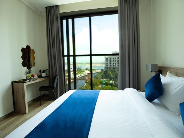 Grand Kingsgate Jaddaf Waterfront Hotel by Millennium : photo 4 de la chambre deluxe room king bed with waterfront view