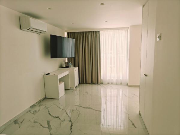 Ibiscus Hotel : photo 4 de la chambre chambre triple - vue sur jardin