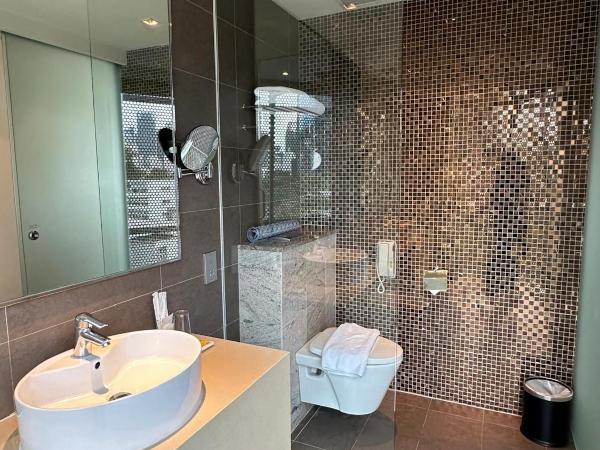 D'Hotel Singapore managed by The Ascott Limited : photo 2 de la chambre chambre lits jumeaux exécutive