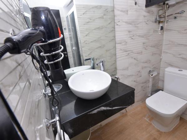 Le 135 appart hotel : photo 5 de la chambre appartement - vue sur jardin