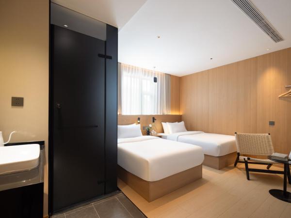 Shanghai Captain 5 Youth Hotel - Xinzhuang Metro Station : photo 1 de la chambre chambre lits jumeaux