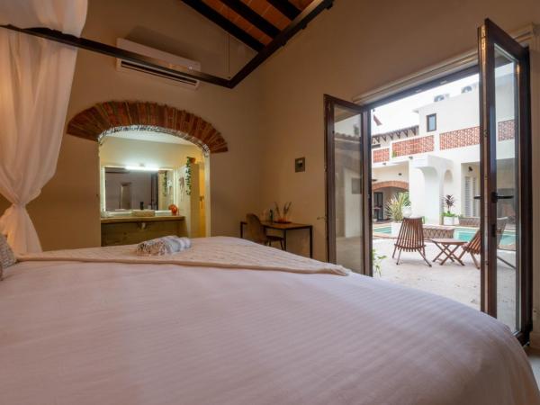 Casa Victoria Malecón - Adults Only : photo 2 de la chambre chambre lit queen-size