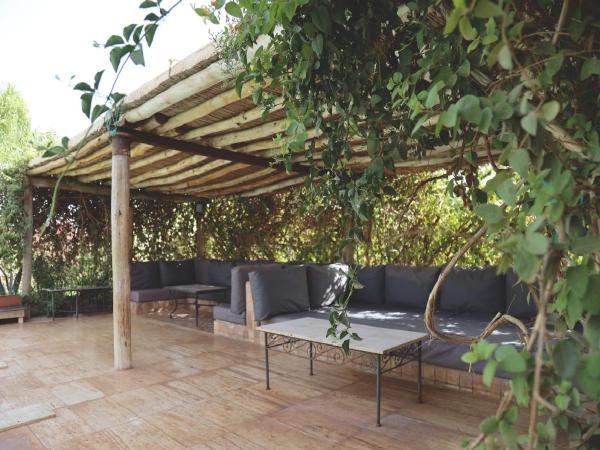 Maison d'Hôtes à Marrakech : photo 3 de la chambre chambre lit king-size - vue sur piscine 