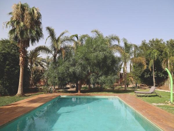 Maison d'Hôtes à Marrakech : photo 4 de la chambre chambre lit king-size - vue sur piscine 