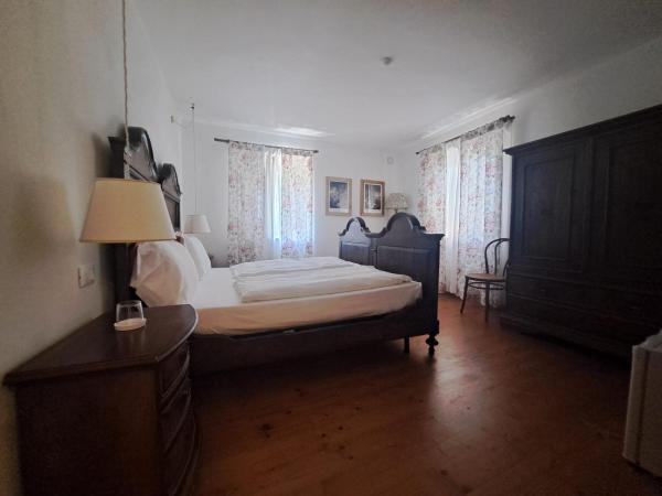 La Vineria di San Mattia : photo 2 de la chambre chambre double ou lits jumeaux standard - vue sur jardin