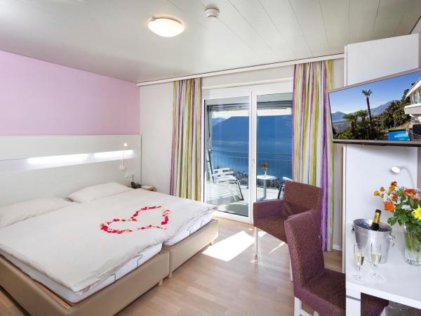 Hotel Stella SA : photo 1 de la chambre chambre double ou lits jumeaux lifestyle - vue sur lac