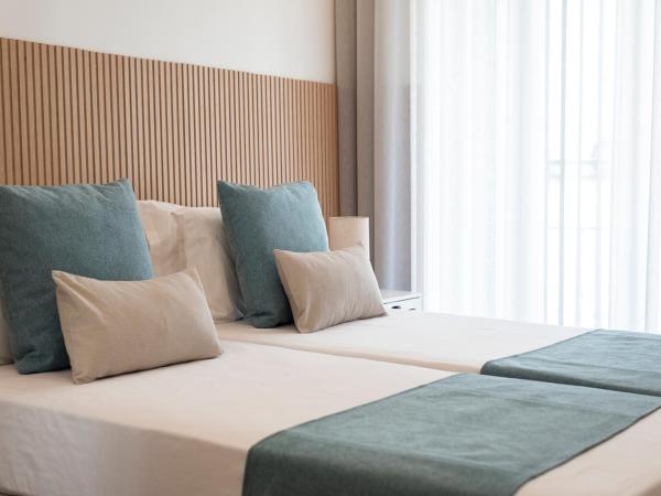 Madalena Hostel e Suites : photo 2 de la chambre chambre double avec salle de bains privative