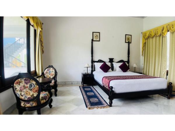 Devraj Villa Udaipur : photo 6 de la chambre chambre double ou lits jumeaux supérieure - vue sur montagnes