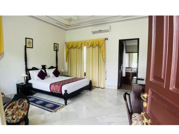 Devraj Villa Udaipur : photo 7 de la chambre chambre double ou lits jumeaux supérieure - vue sur montagnes