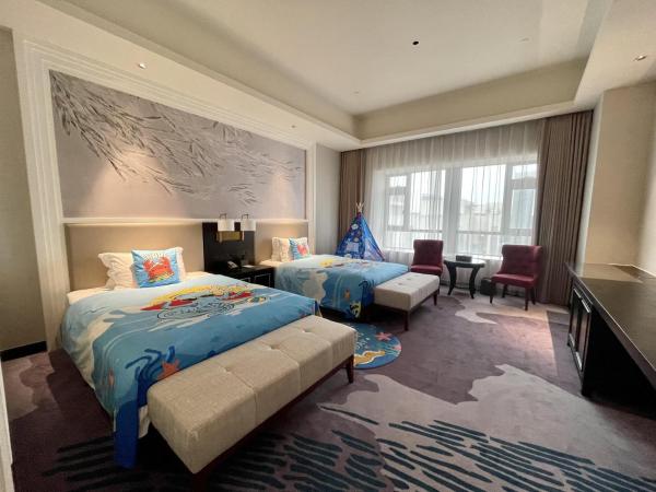 Guangzhou Pan Yu President Hotel : photo 5 de la chambre chambre lits jumeaux spacieuse