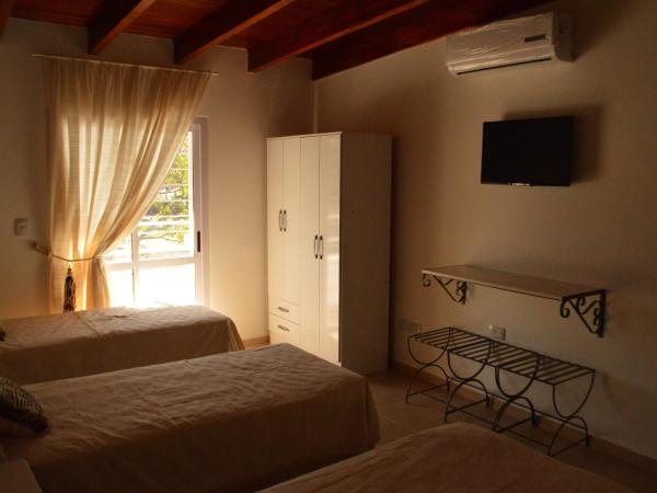 Faro del Parque : photo 1 de la chambre chambre quadruple