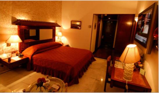 Ashok Country Resort : photo 4 de la chambre chambre double deluxe (2 adultes + 1 enfant)