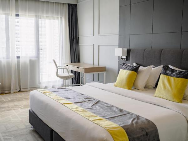 Manhattan Business Hotel, Male : photo 1 de la chambre chambre deluxe (navette aéroport aller-retour gratuite et 10 % de réduction sur la nourriture et les boissons)