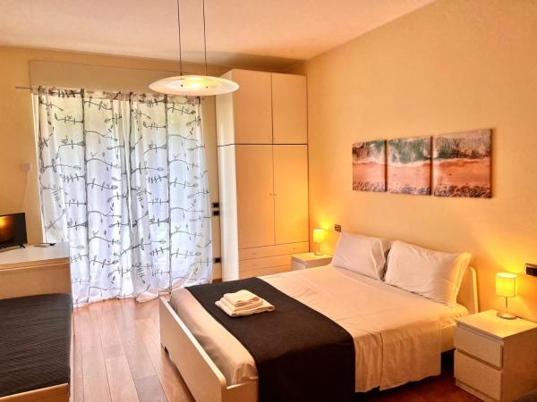 Bergamoinhouse : photo 1 de la chambre chambre quadruple avec salle de bains privative séparée