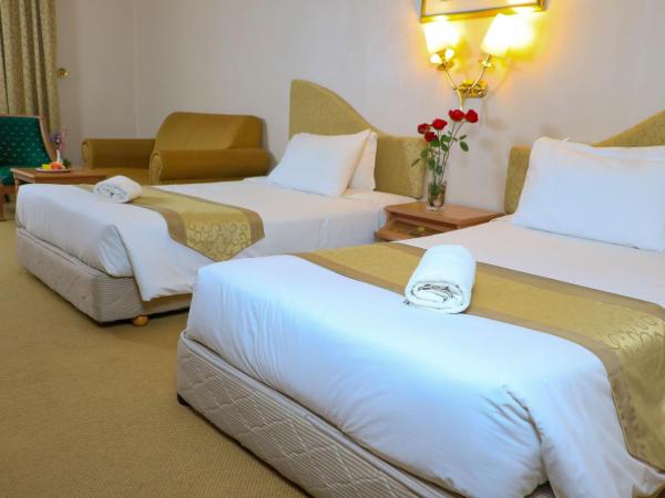 Merdeka Palace Hotel & Suites : photo 3 de la chambre chambre lits jumeaux de luxe 