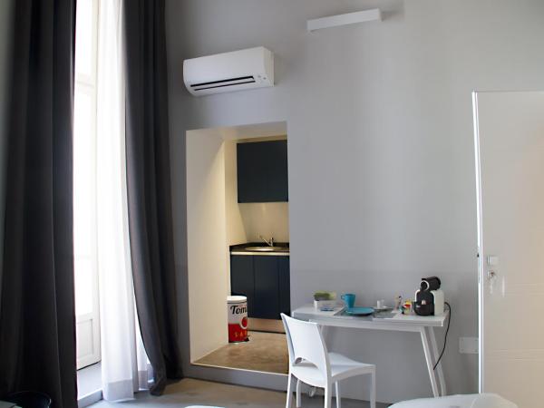 Piazza Castello Suite : photo 5 de la chambre suite deluxe avec balcon