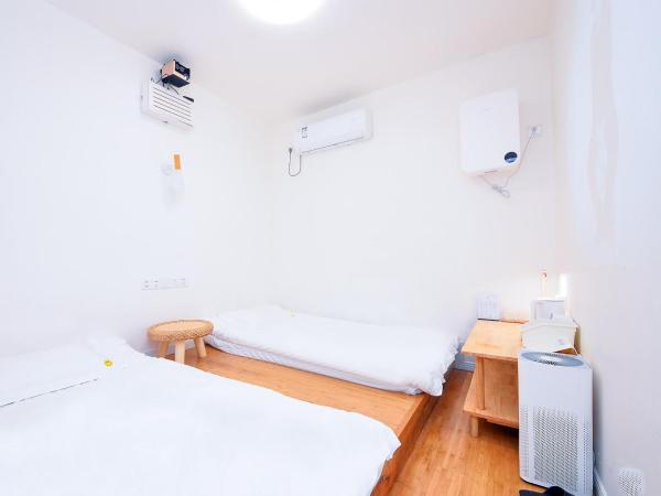 笑脸里青年旅舍宽窄店 : photo 1 de la chambre chambre lits jumeaux