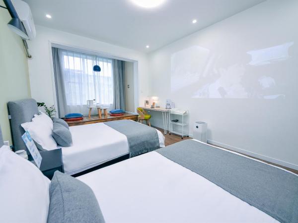 笑脸里青年旅舍宽窄店 : photo 6 de la chambre chambre lits jumeaux