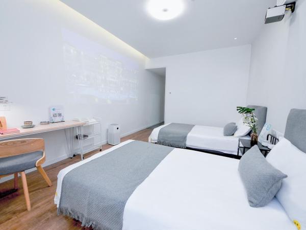 笑脸里青年旅舍宽窄店 : photo 5 de la chambre chambre triple