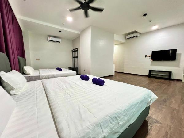 New Margo Hotel KK : photo 4 de la chambre chambre familiale