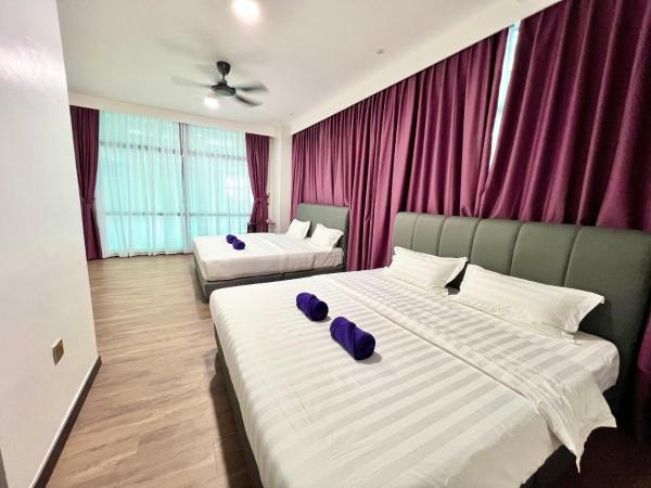 New Margo Hotel KK : photo 2 de la chambre chambre familiale