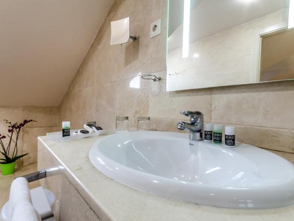 Exe Suites 33 : photo 3 de la chambre chambre triple