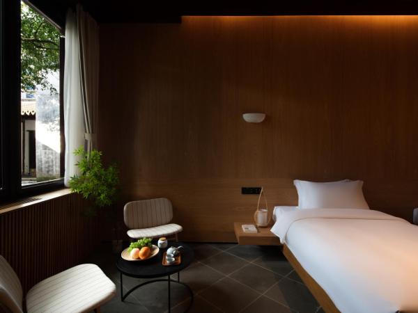 The Linden Centre Suzhou : photo 1 de la chambre chambre lits jumeaux - vue sur cour