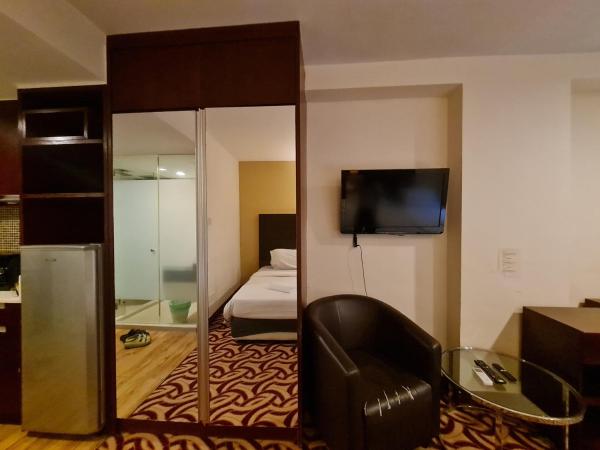 COZY Studio at Ming Garden Residence : photo 4 de la chambre chambre triple confort avec douche