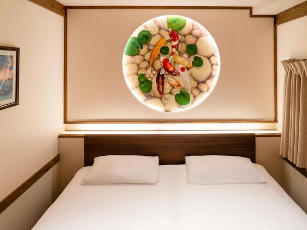 都電屋 TodenHotel : photo 4 de la chambre chambre lits jumeaux avec lit d’appoint - 301