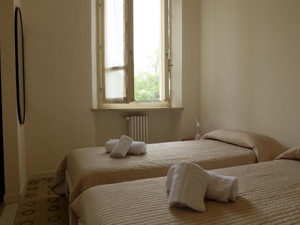 Casa Buri : photo 4 de la chambre chambre triple - vue sur jardin