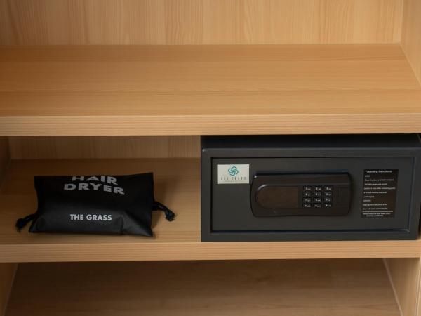 The Grass Serviced Suites : photo 4 de la chambre chambre lit king-size deluxe