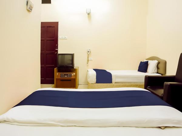 New Casavilla Travellers Lodge Pudu : photo 4 de la chambre chambre triple standard