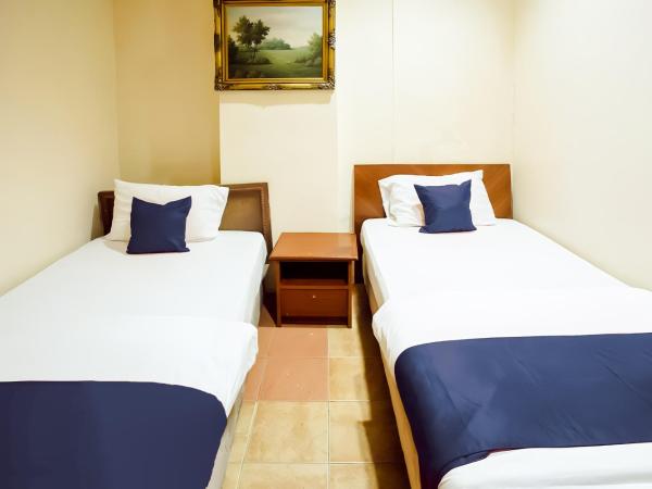 New Casavilla Travellers Lodge Pudu : photo 6 de la chambre chambre lits jumeaux