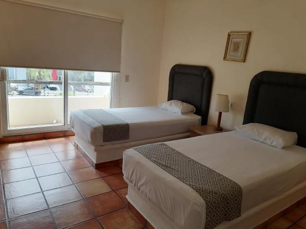 Suites Las Palmas : photo 2 de la chambre chambre double avec 2 lits queen-size