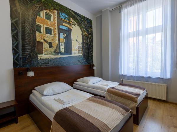 Hotelik w Centrum : photo 9 de la chambre chambre lits jumeaux - vue sur ville