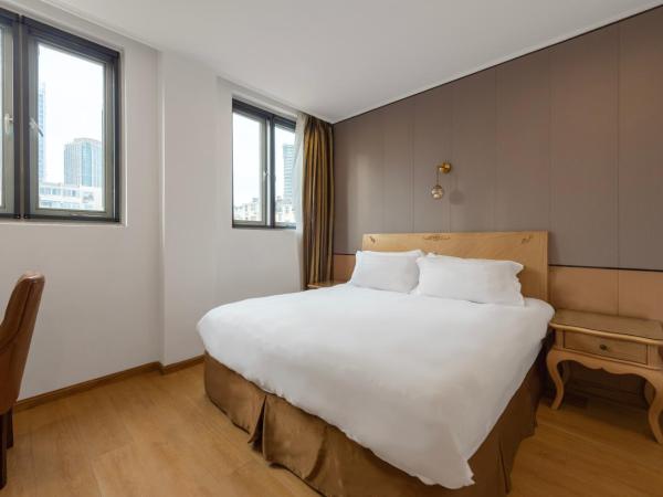 Qingdao Liuying Jieli Hotel - Qingdao Station Trestle Bridge Branch : photo 4 de la chambre chambre supérieure lit queen-size