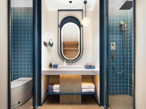 广州番禺万博中心舒与酒店 : photo 2 de la chambre chambre deluxe double ou lits jumeaux