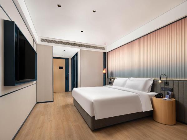 广州番禺万博中心舒与酒店 : photo 3 de la chambre chambre lit queen-size